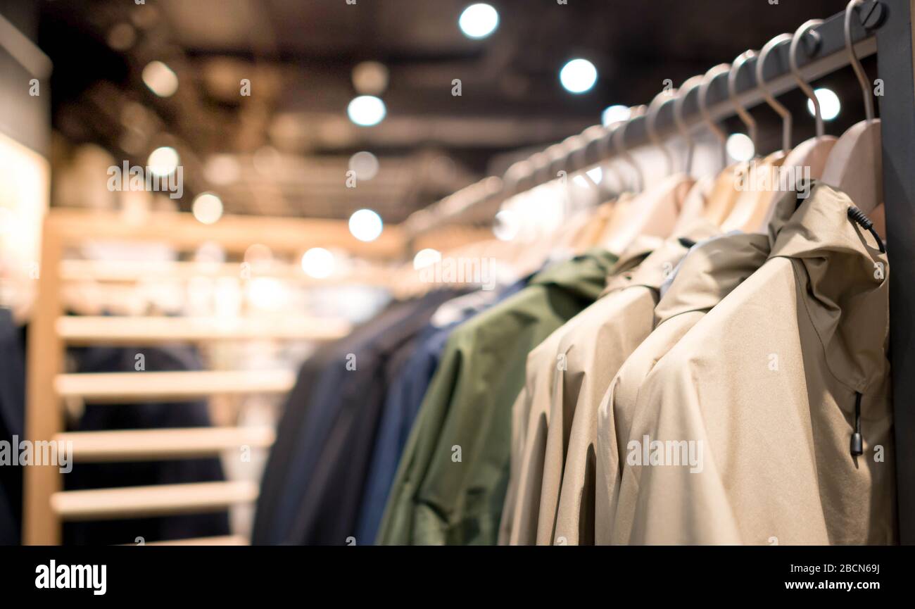 Modern fashion women clothes hang on stanless steel hangers rack at clothing  store department store. Casual clothes online shopping Stock Photo - Alamy