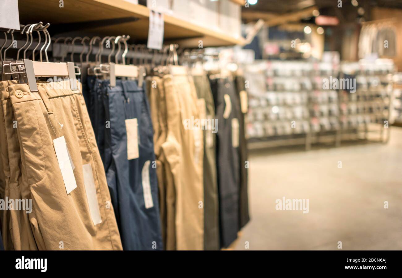 Modern fashion women clothes hang on stanless steel hangers rack at cloth  shop department store. Casual clothes online shopping Stock Photo - Alamy
