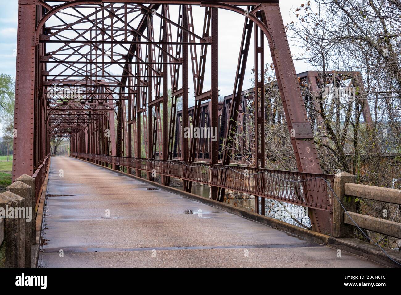 Grand River Bridge (1926) and metal train trestle bridge in Fort Gibson, Oklahoma. (USA) Stock Photo