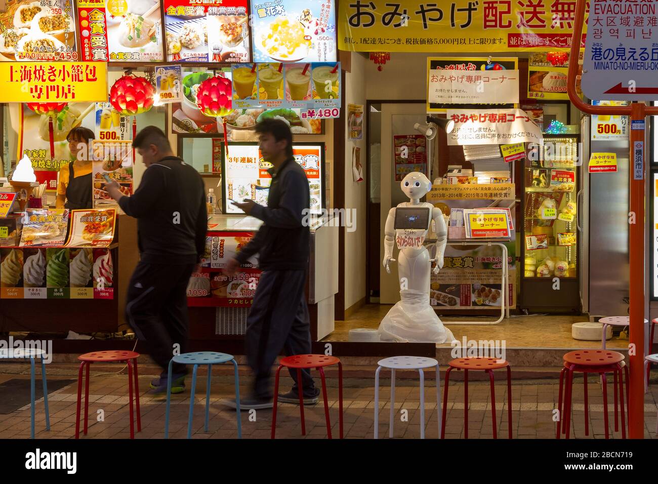 A pepper robot welcomes people to a restaurant in Yokohama China Town. Kanagawa, Japan Stock Photo