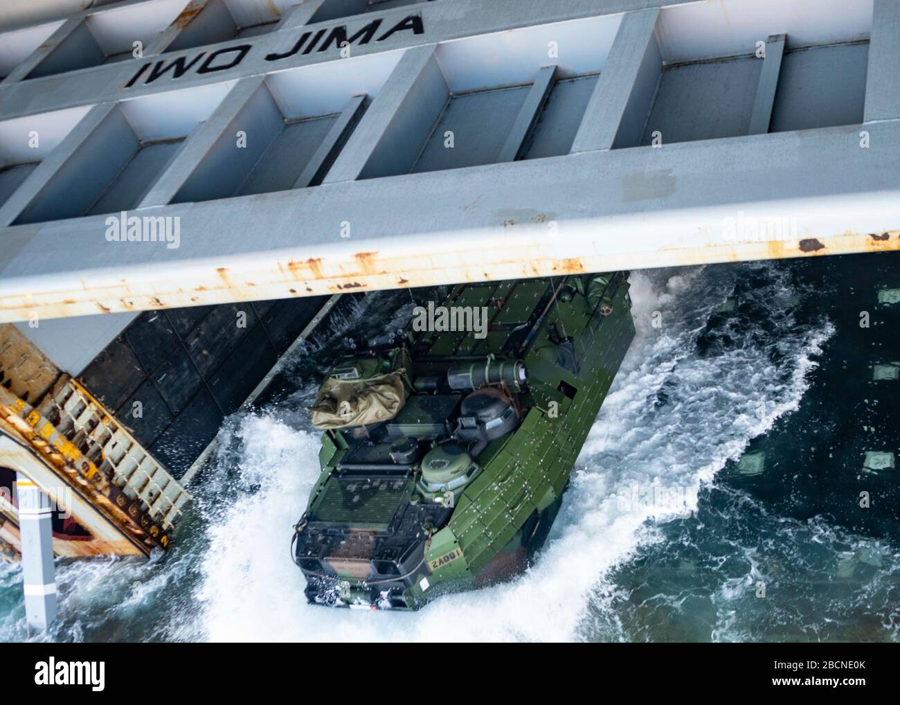 ONSLOW BAY, N.C. (March 18, 2020) – An Amphibious Assault Vehicle (AAV) assigned to 2nd Assault Amphibian Battalion (2nd AABN), 2nd Marine Division based out of Camp Lejeune, N.C. launches off the well deck onboard the Wasp-class amphibious assault ship USS Iwo Jima (LHD 7), March 18, 2020. Iwo Jima and the 2nd AABN are conducting amphibious assault operations certification in the Atlantic Ocean. (U.S. Navy photo by Mass Communications Specialist 3rd Class Jessica Kibena/Released) Stock Photo