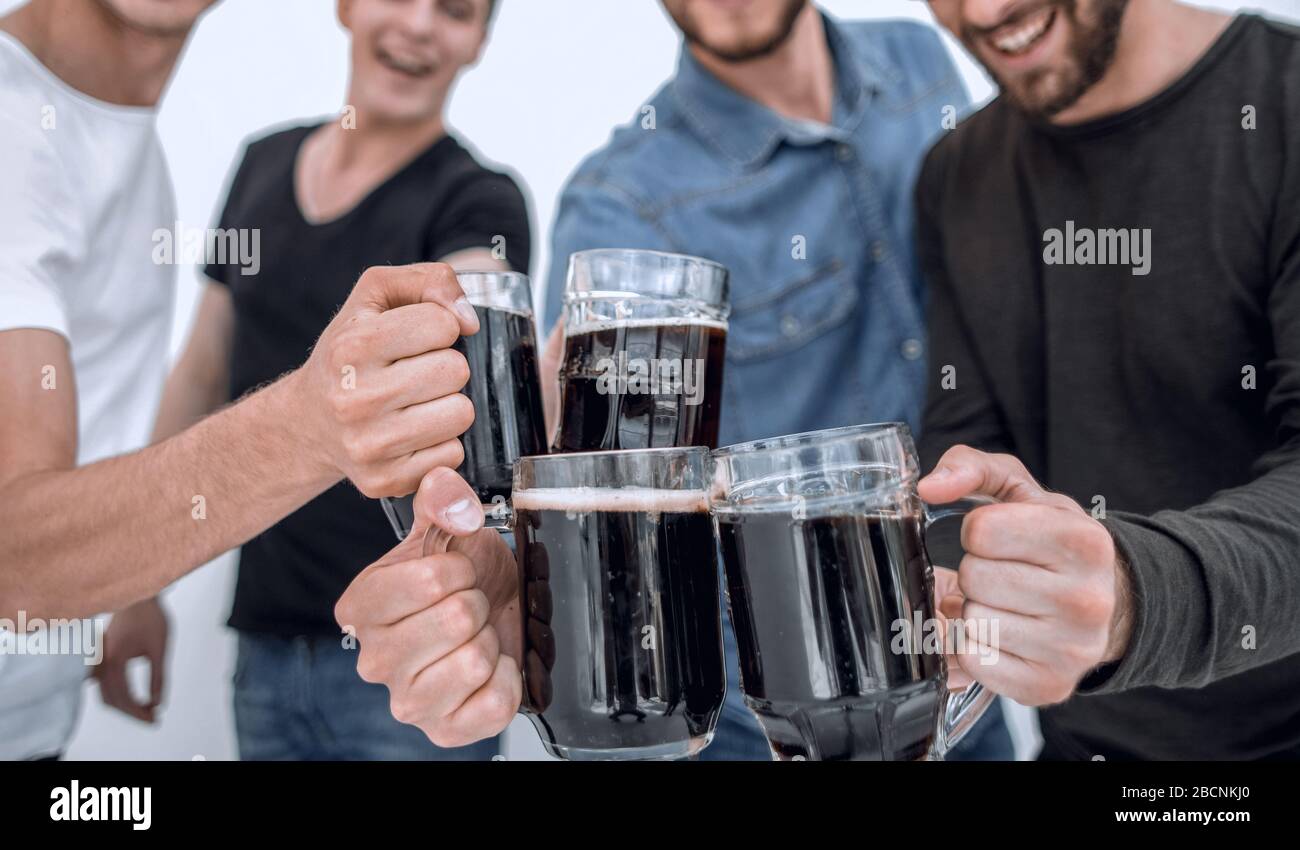 guys with mugs of beer isolated on white background Stock Photo - Alamy