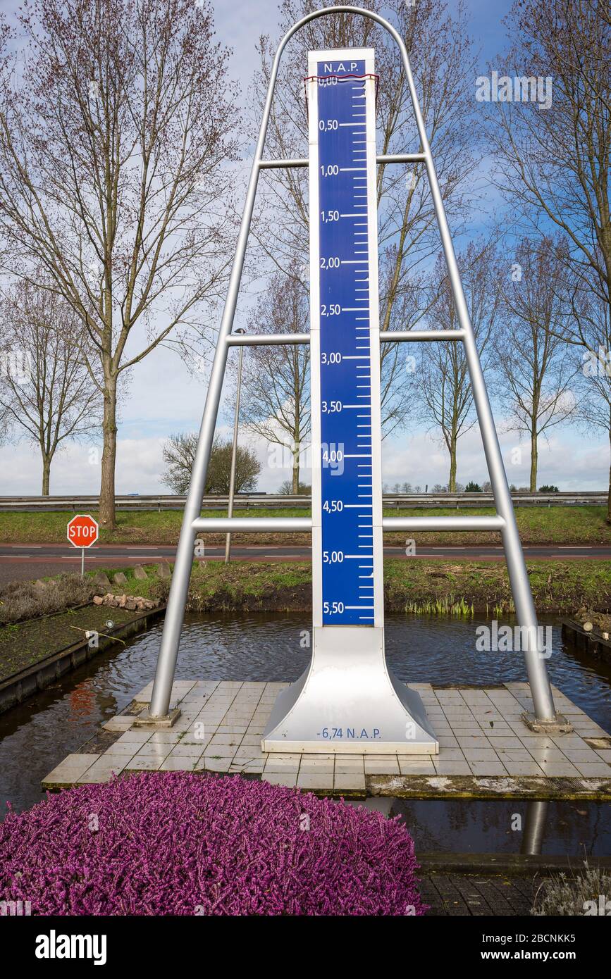 Monument marking the lowest point in the Netherlands at 6 meters and 74 centimeters below sea level Stock Photo
