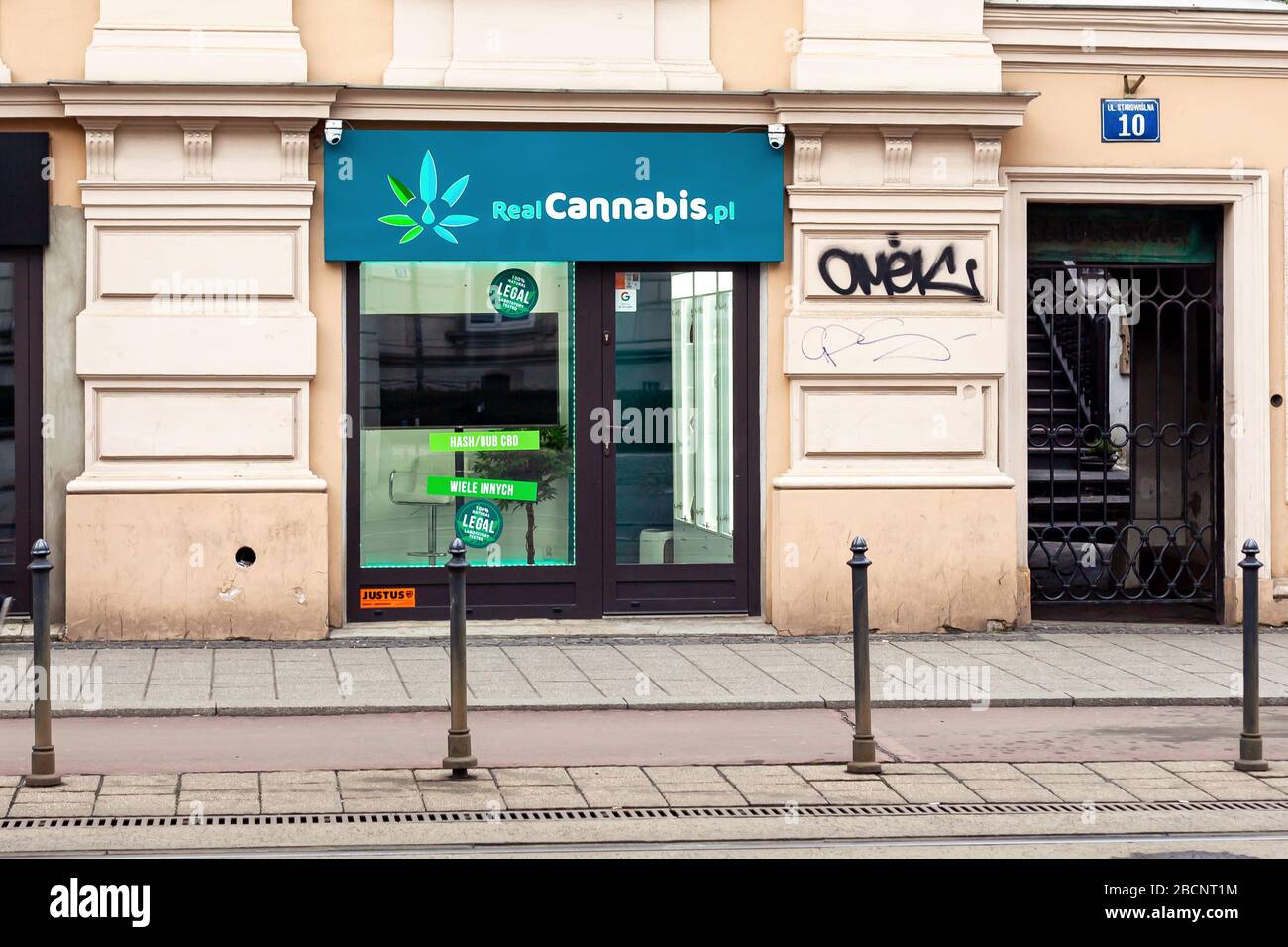 Real Cannabis PL store front, closed. Legal marijuana, hash, CBD liquids, oils, Cannabidiol selling shop frontal shot, street. RealCannabis brand Stock Photo