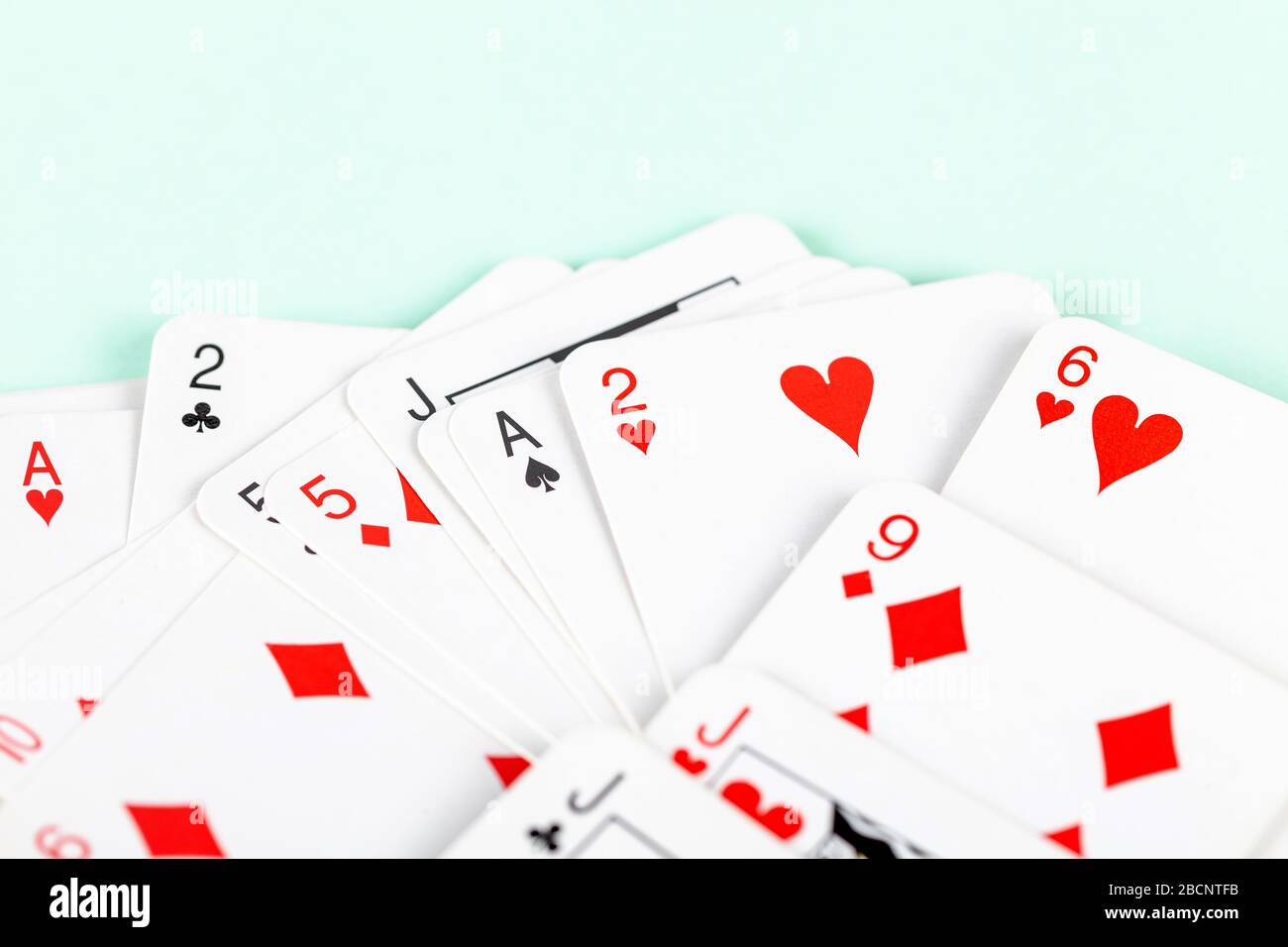 A big pile of tiny small scattered playing cards, macro, closeup, deck.  Heap of mini cards face up abstract blue background texture. Card games  Stock Photo - Alamy