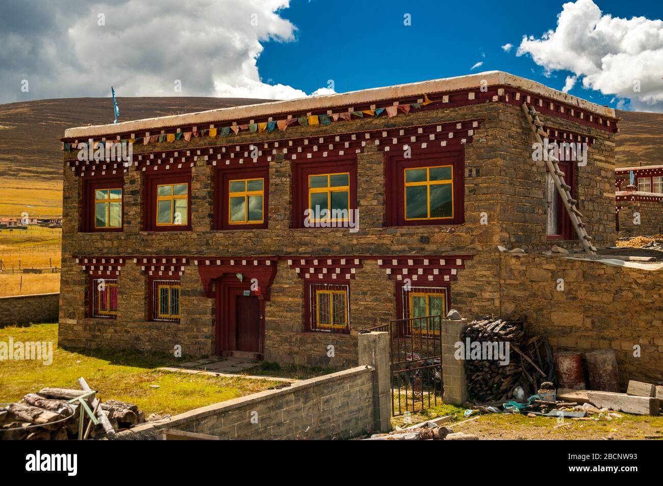 Tibetan style house in Honglong village in the Tibetan area of Sichuan towards the Tibetan border. Stock Photo