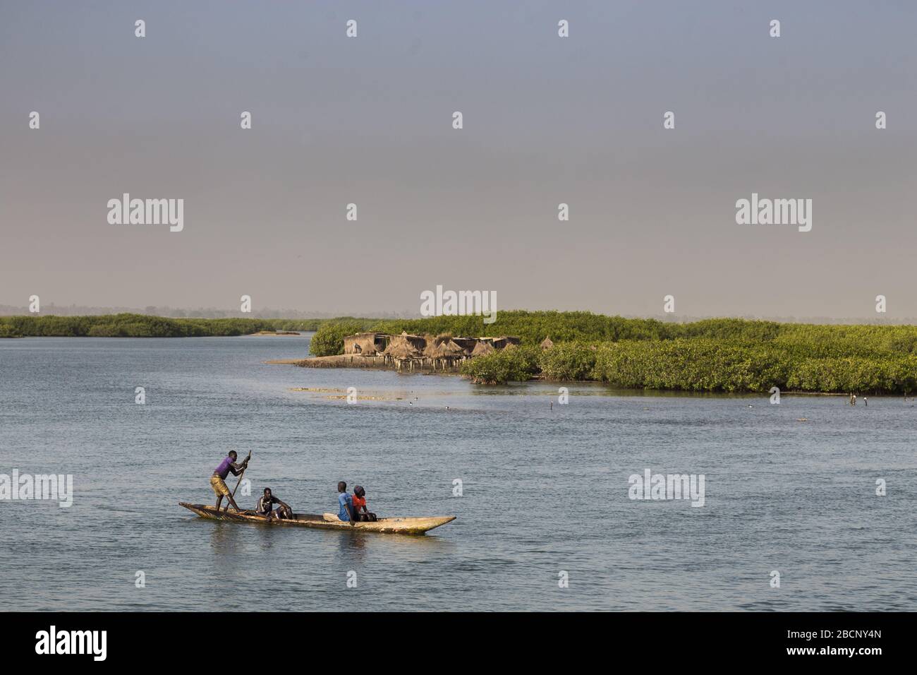 Fishermen in a fishing boat near Joal-Fadiouth in Senegal Stock Photo