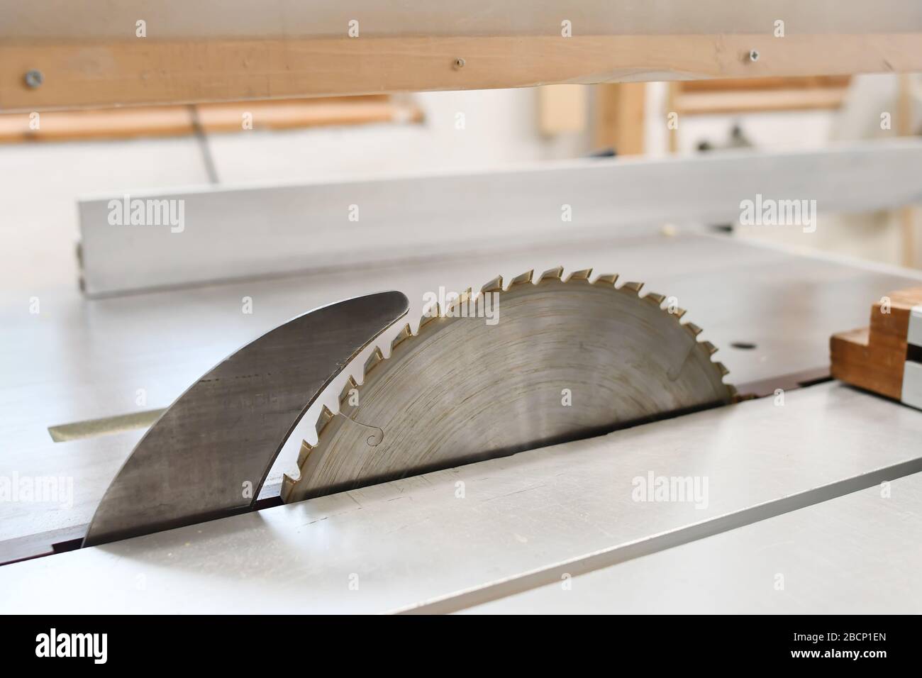 Fragment of a joint wood cutter on a brushed metallic surface. The diamond disc of a wood cutting machine Stock Photo