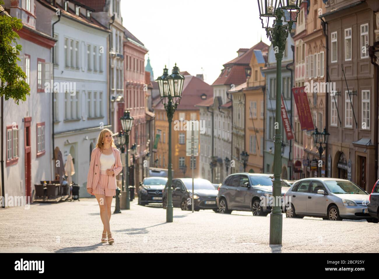 Prague, Czech republic - 20.09.2019: Young blonde woman exploring old town of Prague in sunny day, Czech republic Stock Photo
