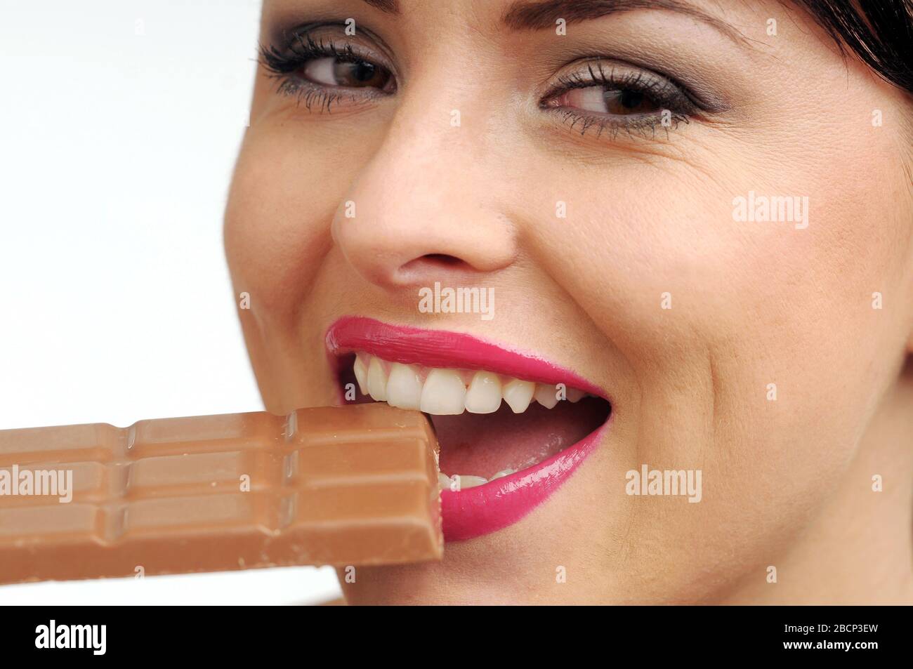 Atractive brunette woman with chokolate. Stock Photo