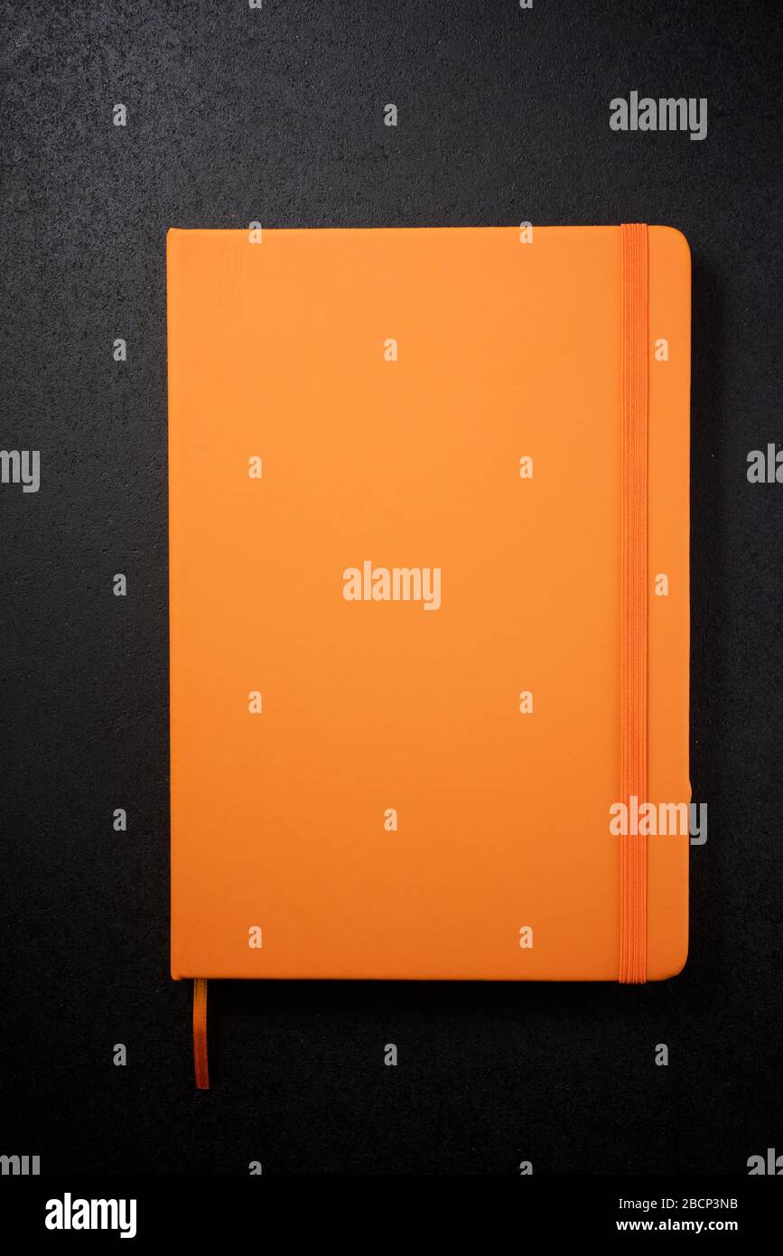 Notebook view on a black table. Stock Photo
