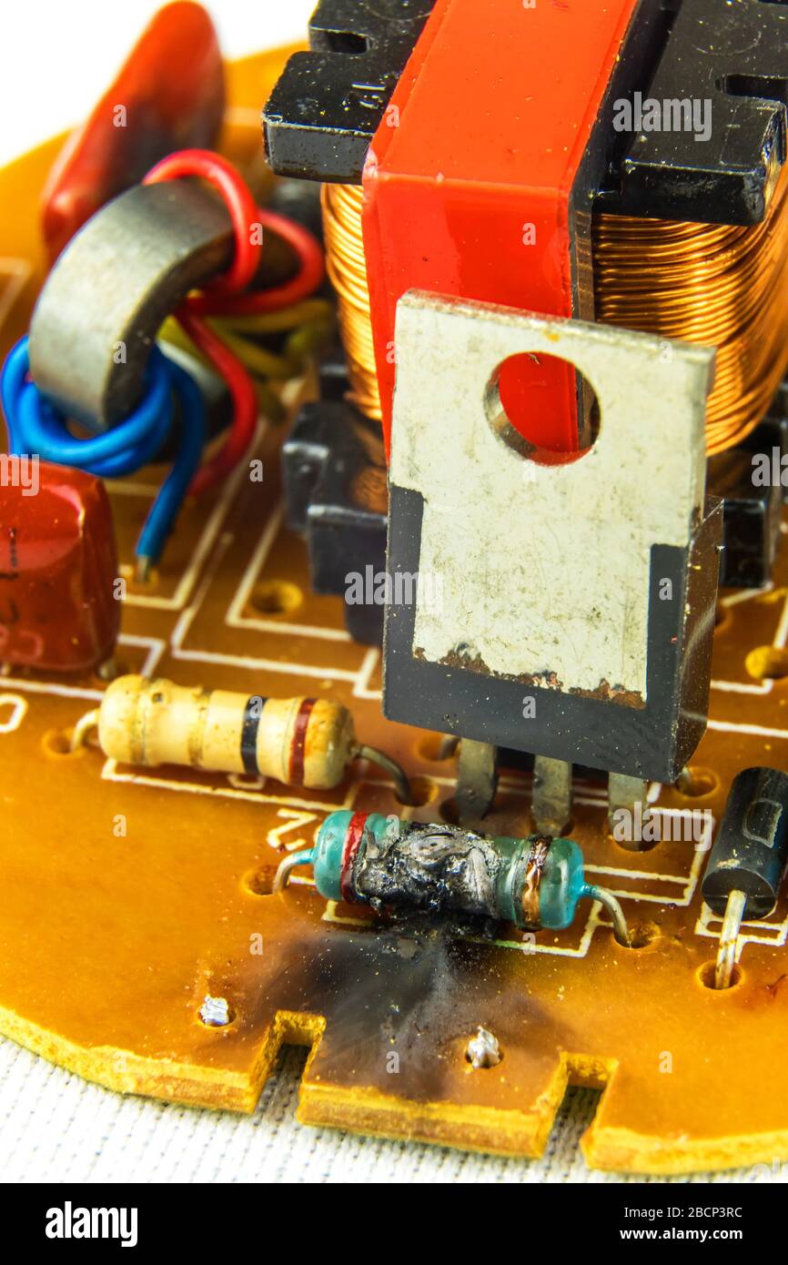 Damaged electronic component LED bulbs. Electronic circuit board has a short circuit. Risk of fire. Faulty electronics. Stock Photo