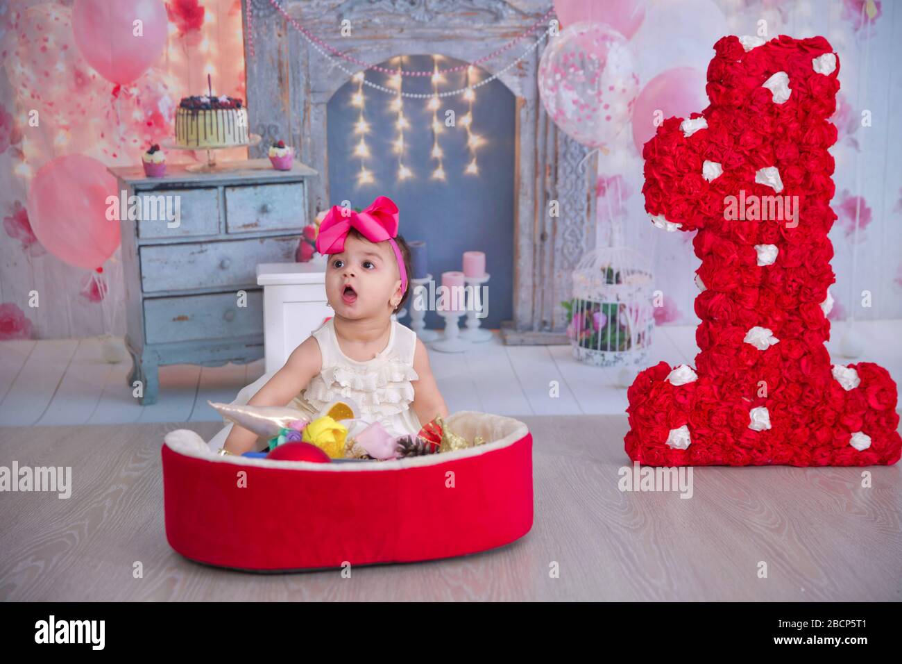 Interior decoration for a kids child birthday is 1 year in . Girl's first  Birthday decorations. Party for little girl. Number one on background .  Baku Stock Photo - Alamy