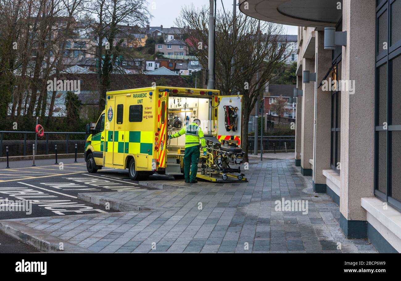 Cork City, Cork, Ireland. 05th April, 2020.A paramedic loads a gurney back on to his ambulance after admitting a patient to the Mercy Hospital on Grenville Place in Cork City, Ireland.  Credit; David Creedon / Alamy Live News Stock Photo