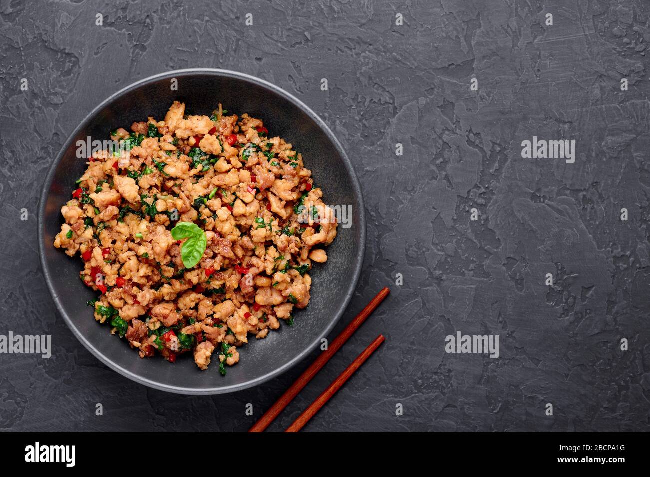 Pad Krapow Gai Thai Basil Chicken In Black Bowl At Dark Slate Background Pad Krapow Is Thai Cuisine Dish With Minced Chicken Or Pork Meat Basil S Stock Photo Alamy