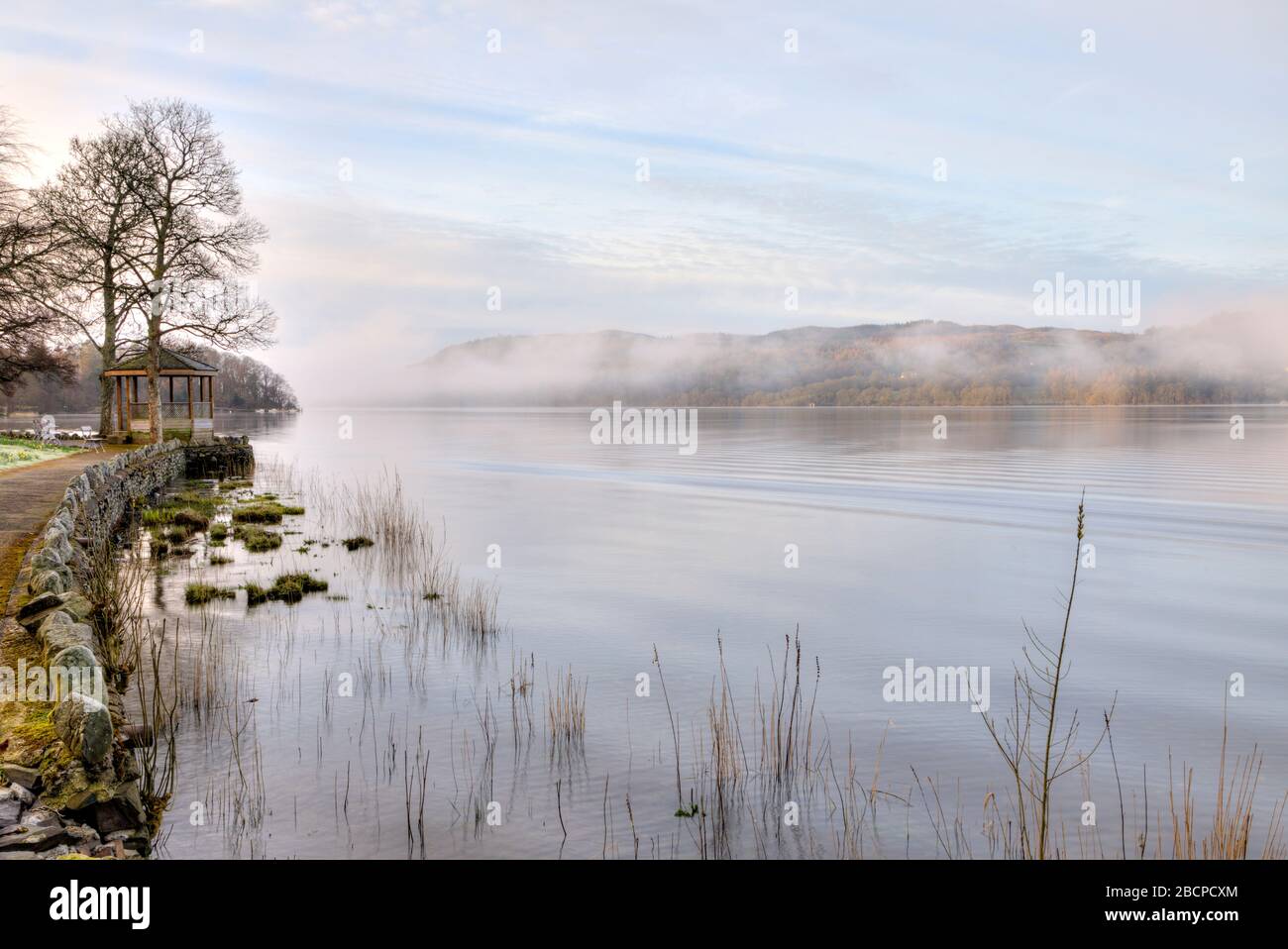 Misty early morning at Lake Windermere high key Stock Photo