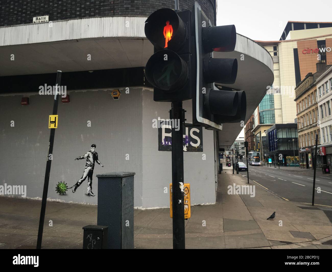 Glasgow, UK. 5th Apr, 2020. A new mural by the street artist The Rebel Bear depicting a man chained to a virus molecule, in empty streets in the city centre, illustrating that social distancing guidelines and 'stay at home' advisories are being adhered to in the time of Coronavirus COVID-19 pandemic crisis. Photo Credit: jeremy sutton-hibbert/Alamy Live News Stock Photo