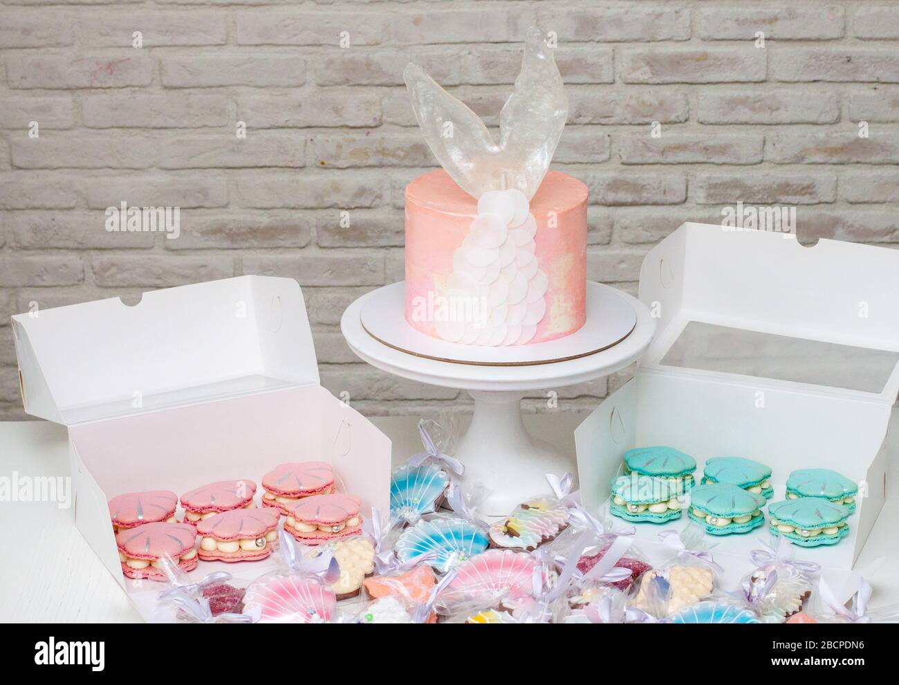 Mermaid theme candy bar with cake, cupcakes, macaroons and biscuits ...