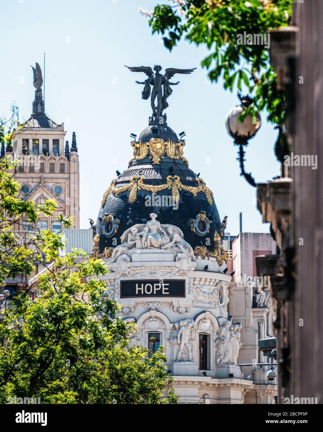 Emblematic buildings in Madrid, with the word 'HOPE' message of optimism, due to the crisis of the COVID-19. Spain. Stock Photo