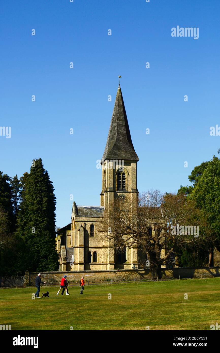 5th April 2020, Southborough Common, Kent, UK: People out taking exercise and enjoying a gorgeous spring day for Palm Sunday on Southborough Common. In the background is St Peter's church. The government has imposed quarantine / lockdown measures to reduce the spread of the coronavirus during the worldwide pandemic. People are still allowed to exercise once a day as long as they maintain at least a 2m distance between each other Stock Photo