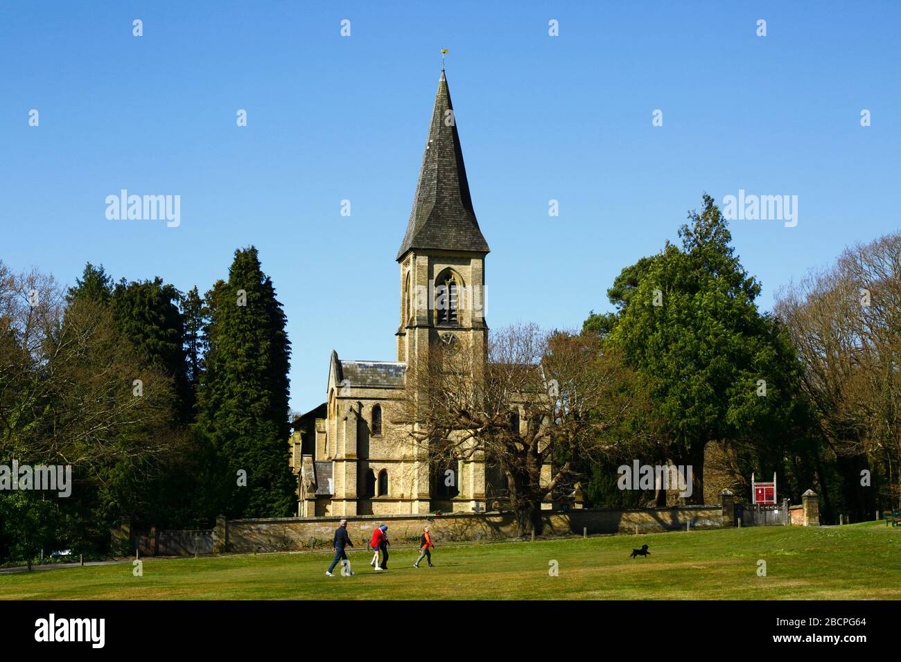 5th April 2020, Southborough Common, Kent, UK: People out taking exercise and enjoying a gorgeous spring day for Palm Sunday on Southborough Common. In the background is St Peter's church. The government has imposed quarantine / lockdown measures to reduce the spread of the coronavirus during the worldwide pandemic. People are still allowed to exercise once a day as long as they maintain at least a 2m distance between each other Stock Photo