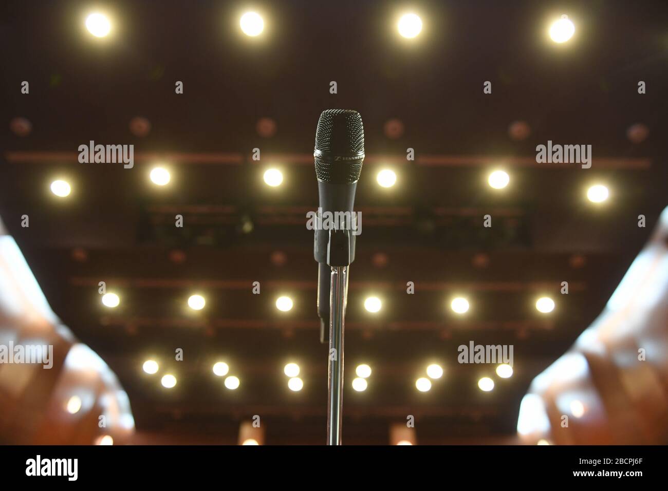 Microphone in front of an empty theatre hall Stock Photo - Alamy