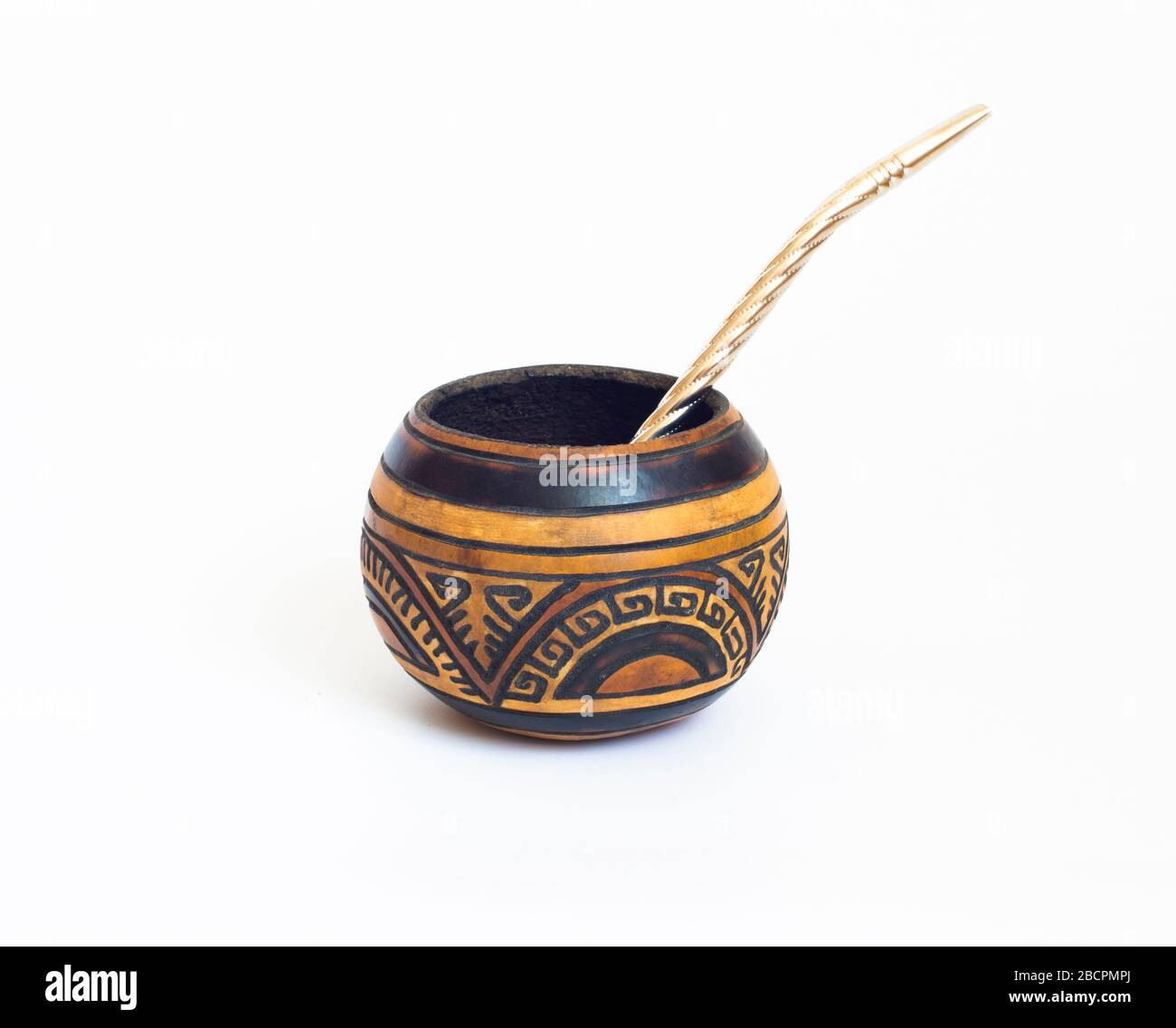 Mate gourds and bombilla - yerba mate vessels made out of calabash. cup of mate from South America. White isolated background. Typical drink from Stock Photo