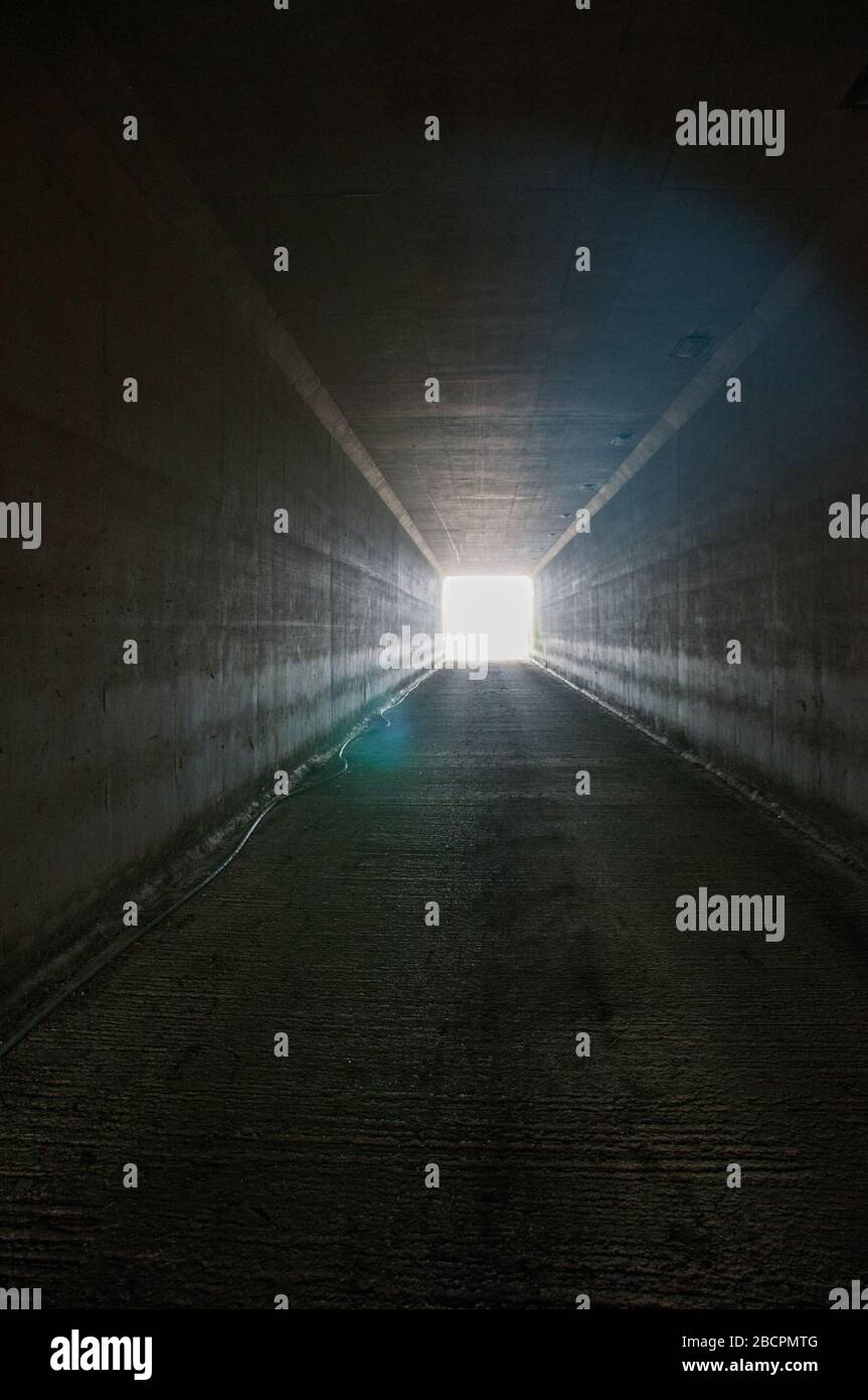 Light at the end of the tunnel! A sign of the problems that the world is facing with the Coronavirus pandemic that is sweeping the world. Stock Photo
