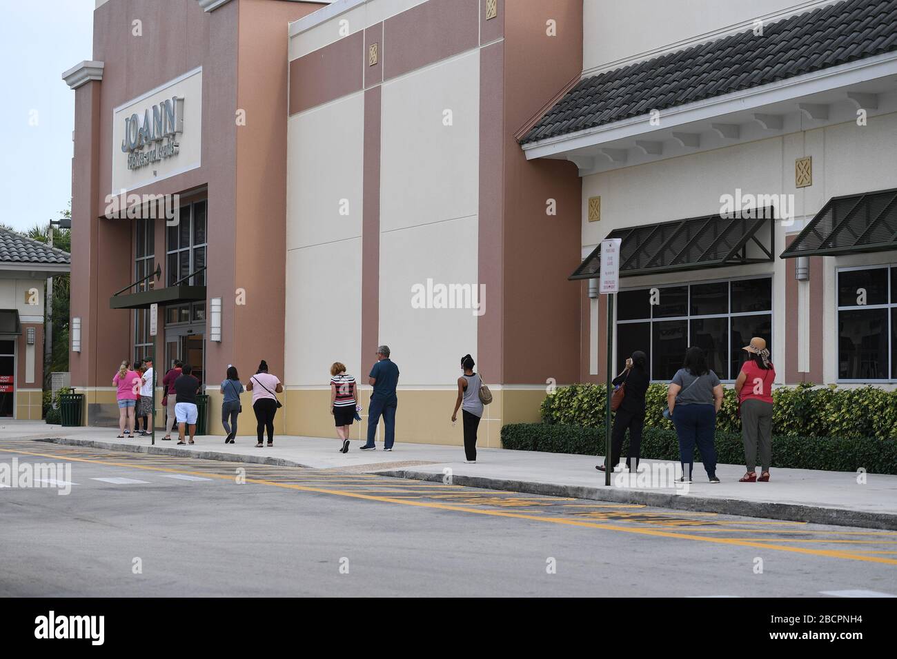 COCONUT CREEK, FL - APRIL 04: Shoppers line up outside Joann Fabrics and Crafts to get material to make masks due to the Coronavirus (COVID-19) pandemic on April 4, 2020 in Coconut Creek, Florida. Credit: mpi04/MediaPunch Stock Photo