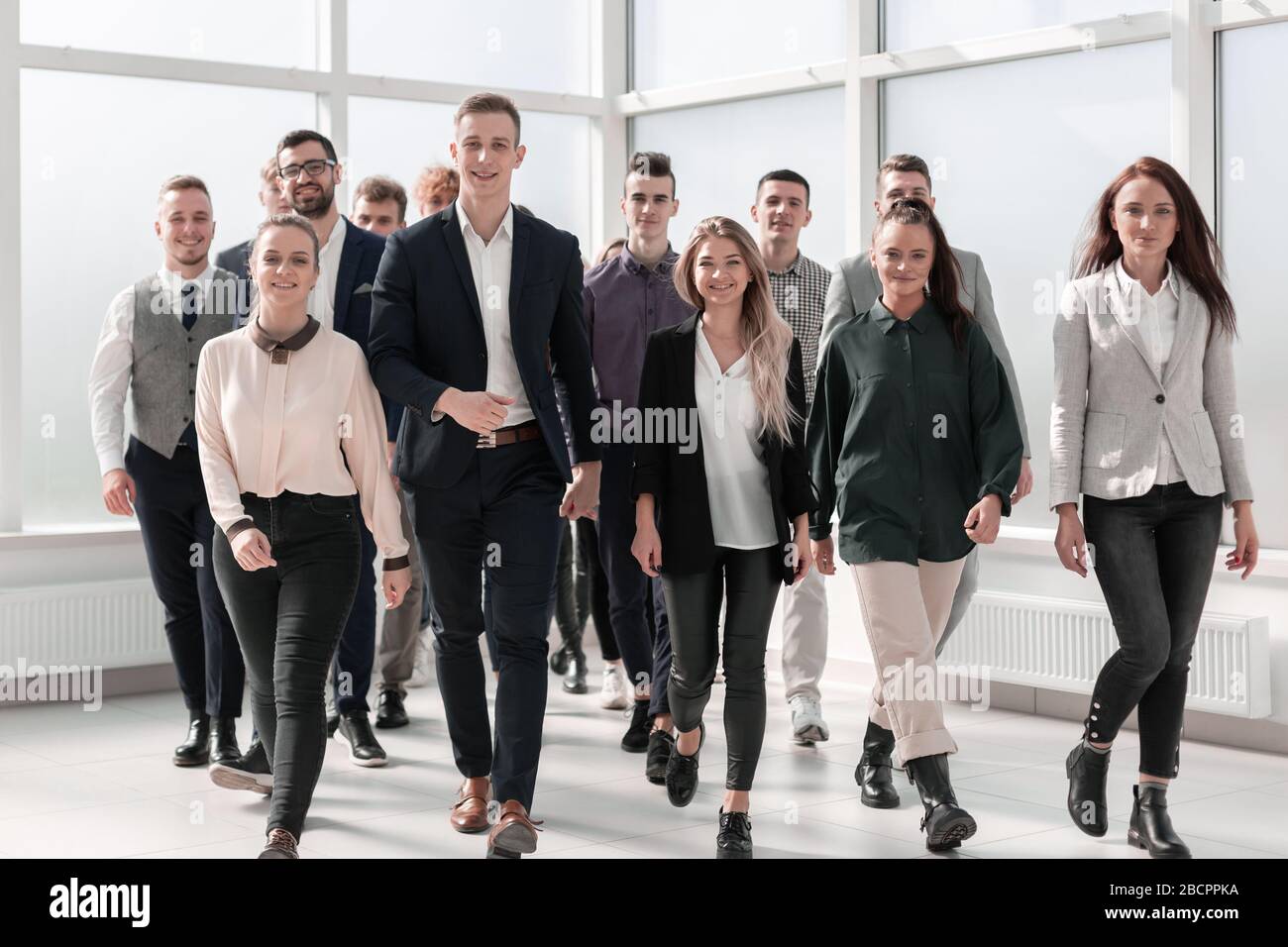 young business people walking together in a new office Stock Photo - Alamy