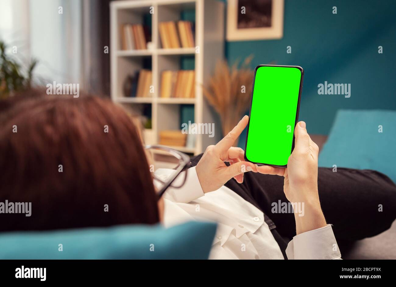Female using smartphone, chromakey Stock Photo