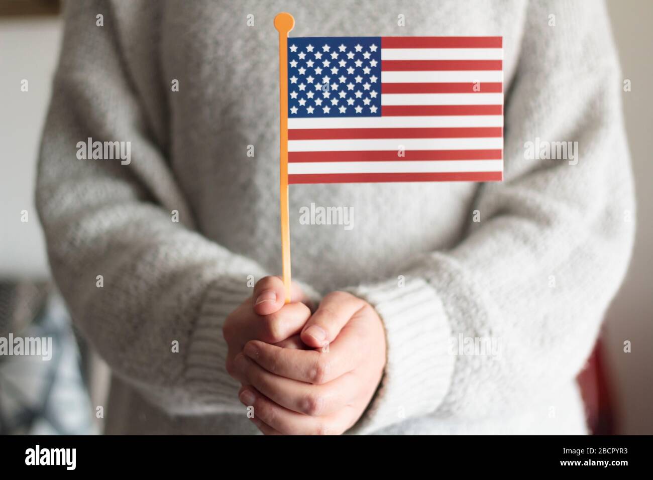 Woman holding american flag props Stock Photo Alamy