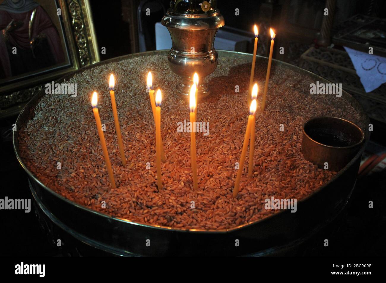 Lighting candles inside a Greek orthodox church Stock Photo Alamy