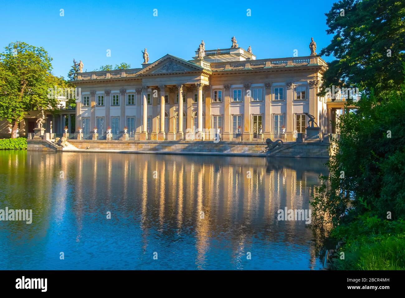 Poland, Warsaw. Lazienki palace with reflection in pond water in the park, Lazienki Krolewskie Stock Photo