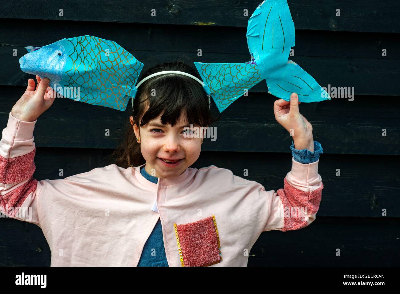 7-year old girl home schooled art class fish Stock Photo