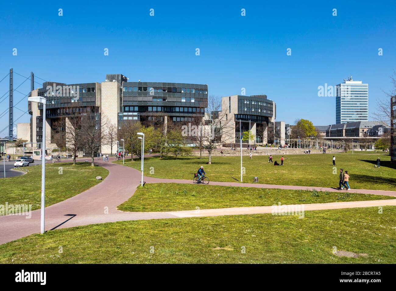 New everyday situation due to coronavirus pandemic. Despite the best spring weather, safety regulations must be observed. City center with statehouse. Stock Photo