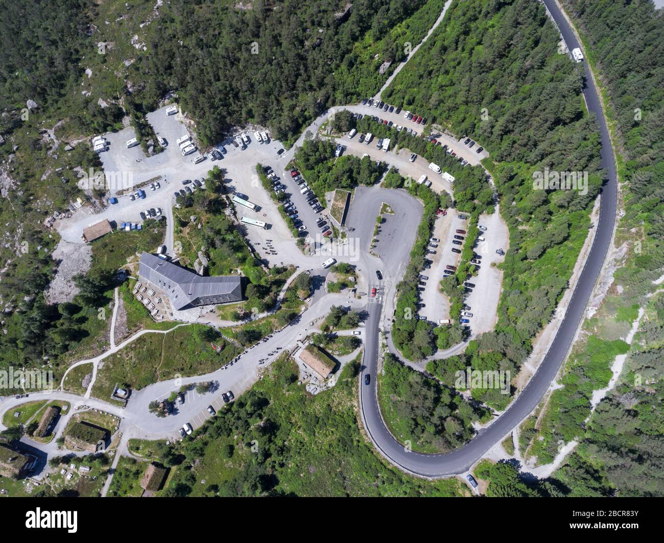 JORPELAND, NORWAY-CIRCA JUL, 2018: Preikestolvegen asphalt road passes ...
