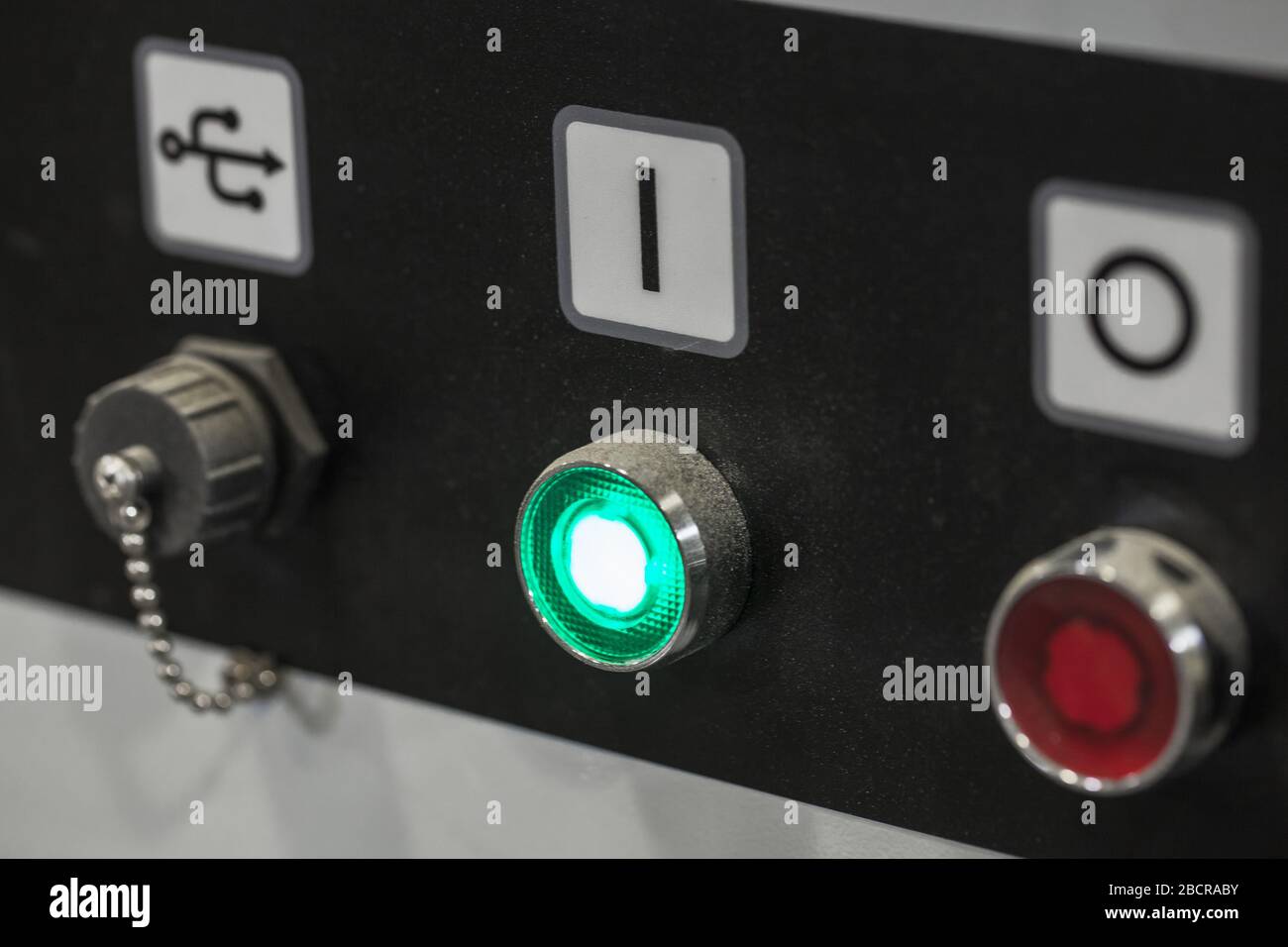 Industrial equipment control panel with start stop buttons and usb socket, close-up photo with selective soft focus Stock Photo