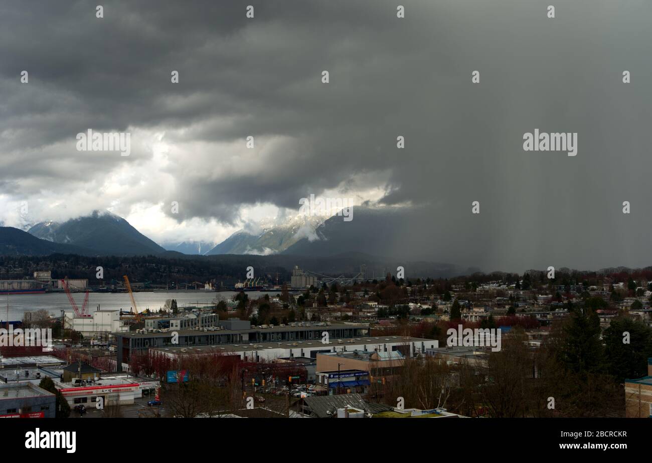 Threatening sky, Weather whim, Anger storm hail and dark clouds over Vancouver, BC, Canada Stock Photo