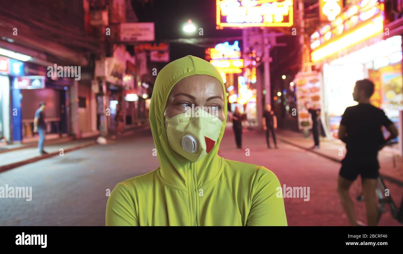 Woman close up look caucasian at Pattaya Walking Street with wearing protective medical mask. Lockdown quarantine isolation. Coronavirus covid-19. Stock Photo