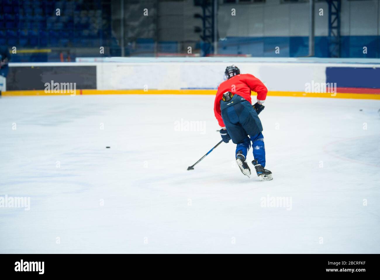Professional ice hockey player in red on the ice Stock Photo Alamy