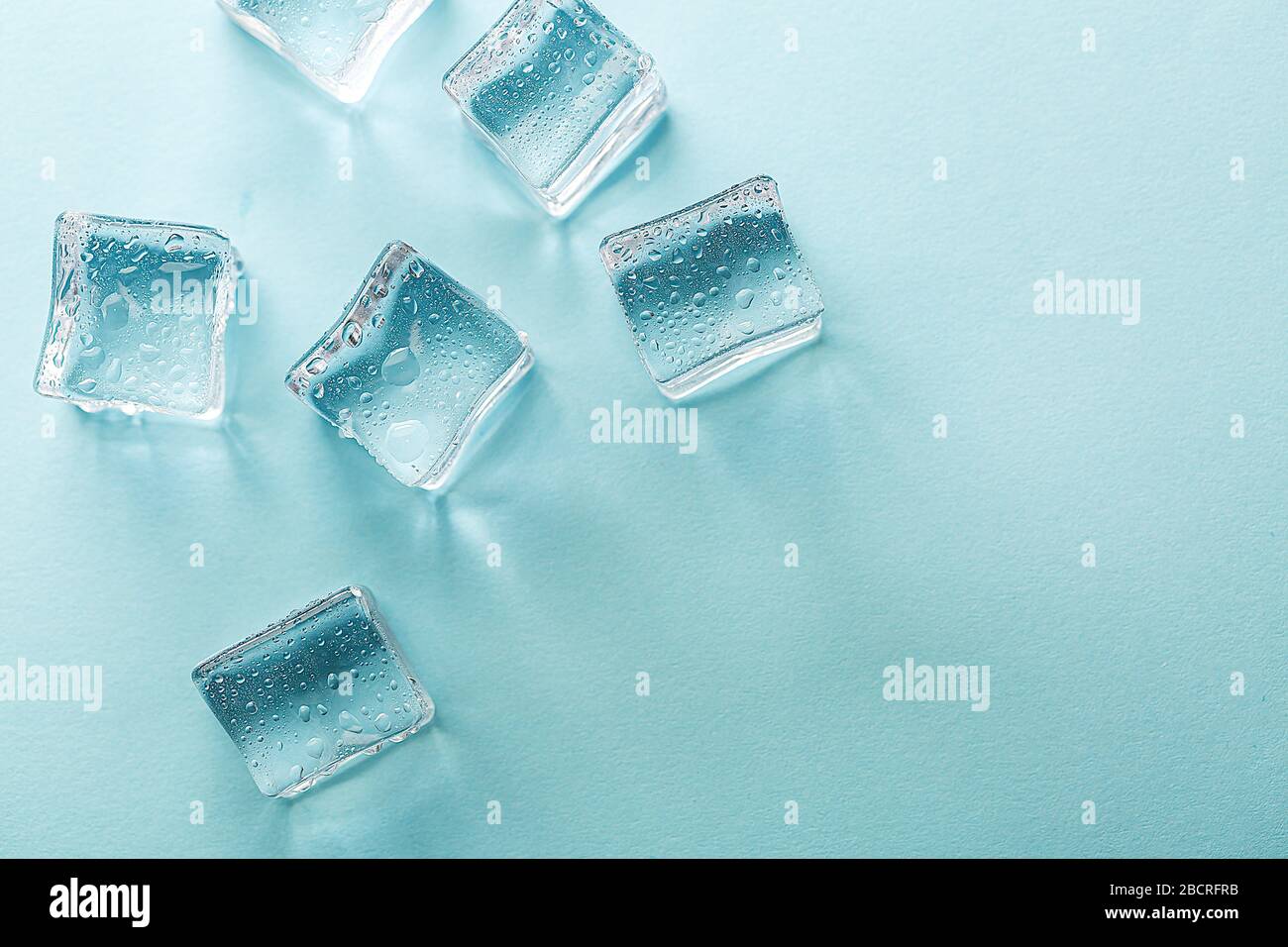 Colored banner with fresh ice cubes and reflections Stock Photo