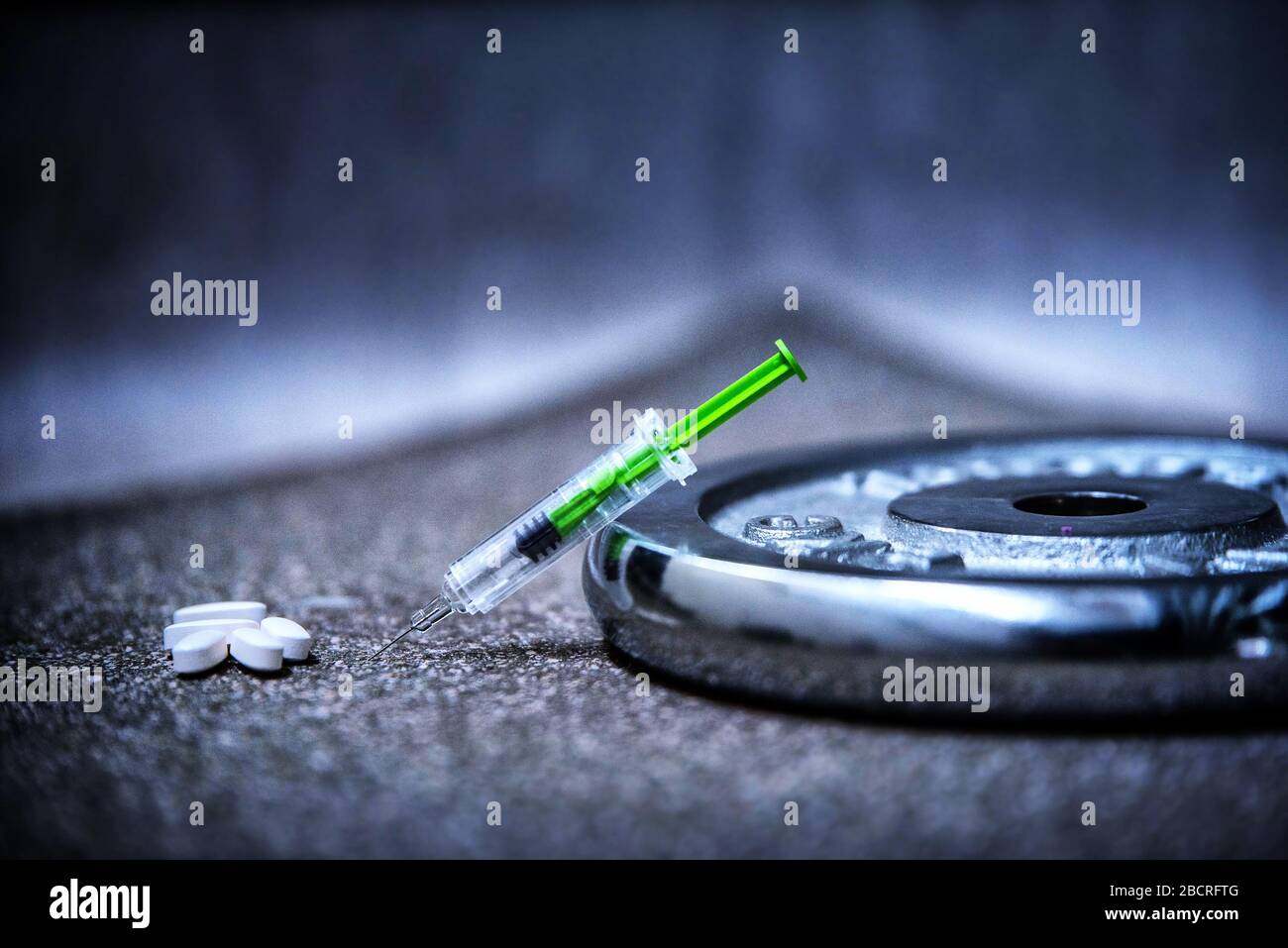 Doping in sport and steroid abuse concept with a dumbbell, Stock Photo