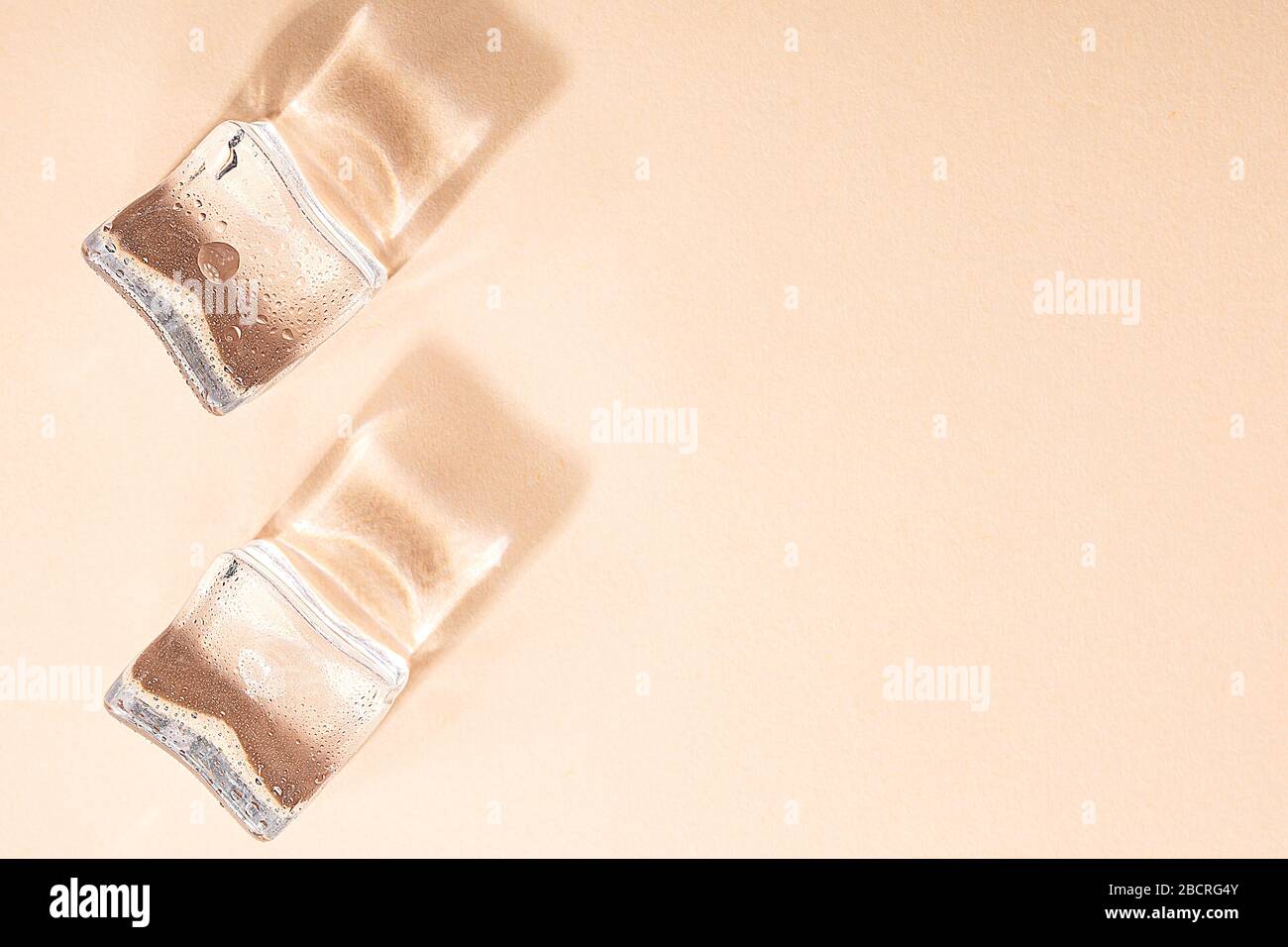 Colored banner with fresh ice cubes and reflections Stock Photo