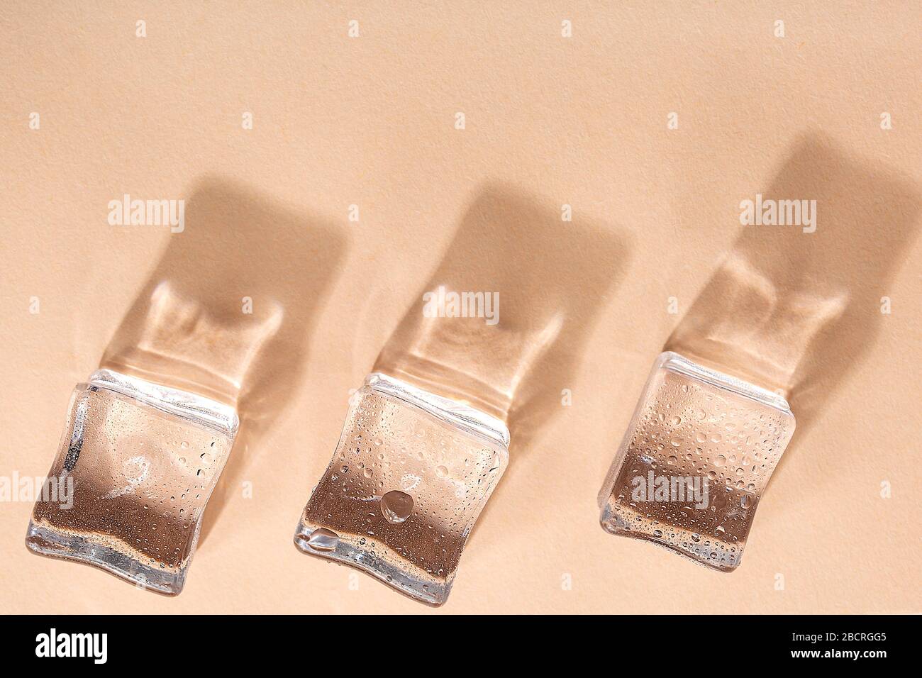 Colored banner with fresh ice cubes and reflections Stock Photo