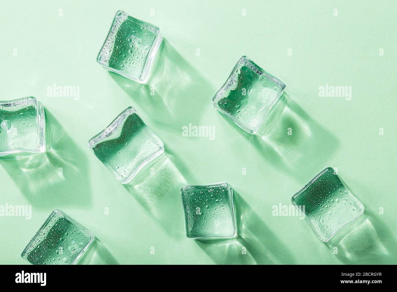 Colored banner with fresh ice cubes and reflections Stock Photo