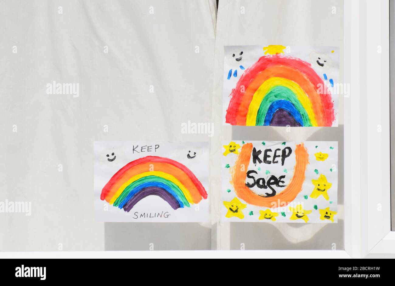 Wiltshire UK. April 7 2020. rainbow for hope pictures in the window of a house during the British Coronavirus Covid-19 lockdown Stock Photo