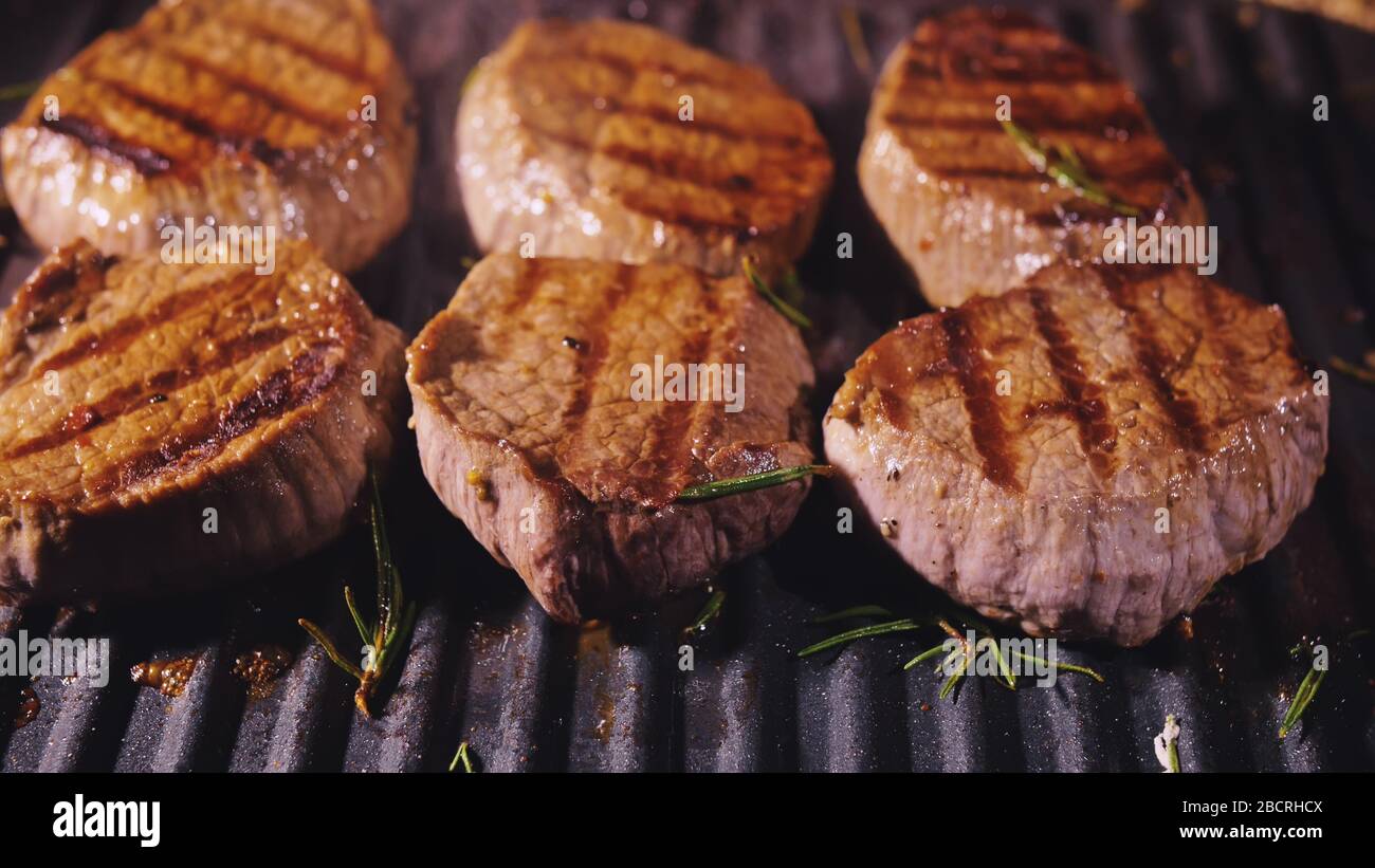 Delicious juicy meat steak cooking on grill. Prime beef fry on electric