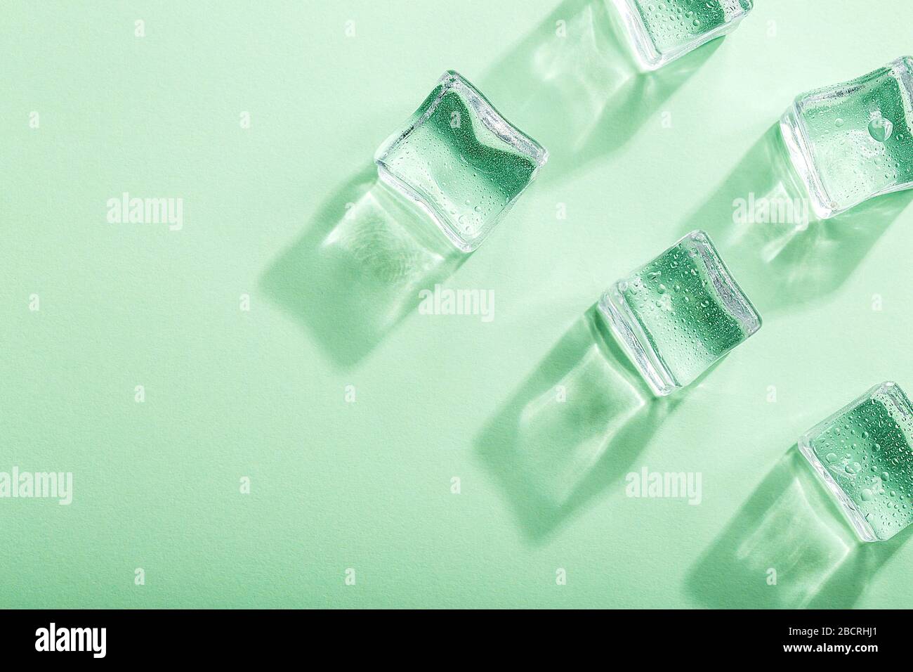 Colored banner with fresh ice cubes and reflections Stock Photo