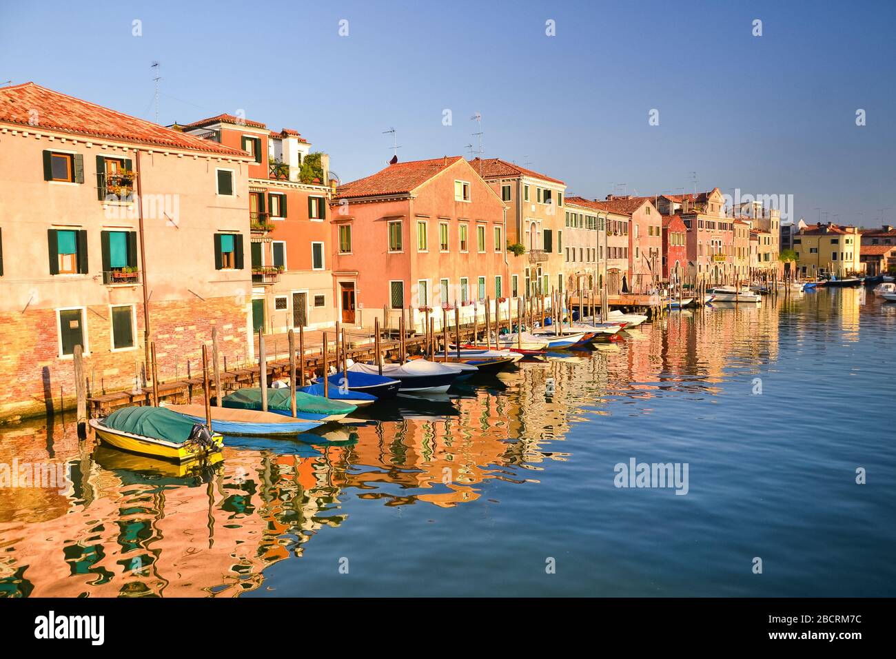 Beautiful colorful houses and boats, Venice landmark, Scenery from famous canal, Italy, Europe Stock Photo